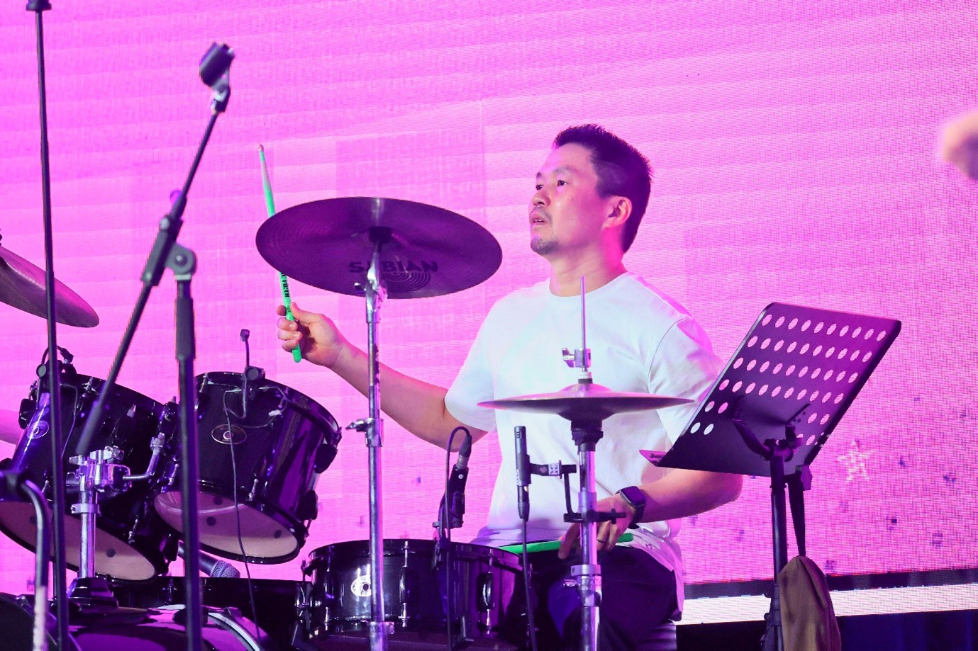 A man playing a drum set.