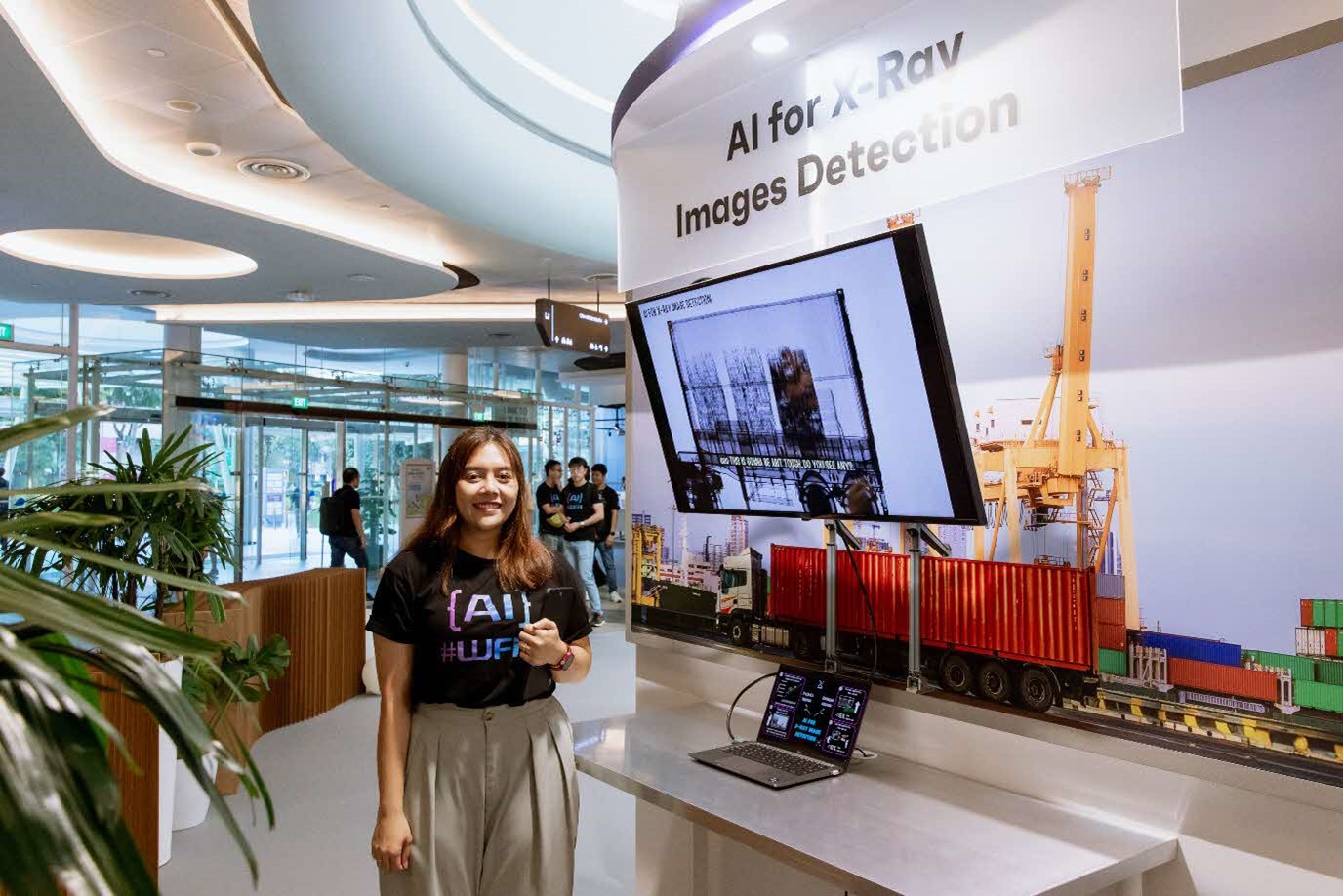 Woman posing at AI for X-Ray Images Detection booth.