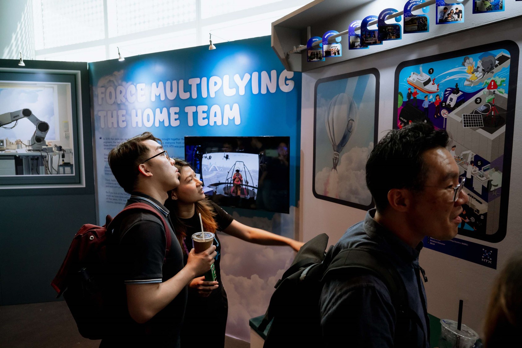 People standing at an exhibition.