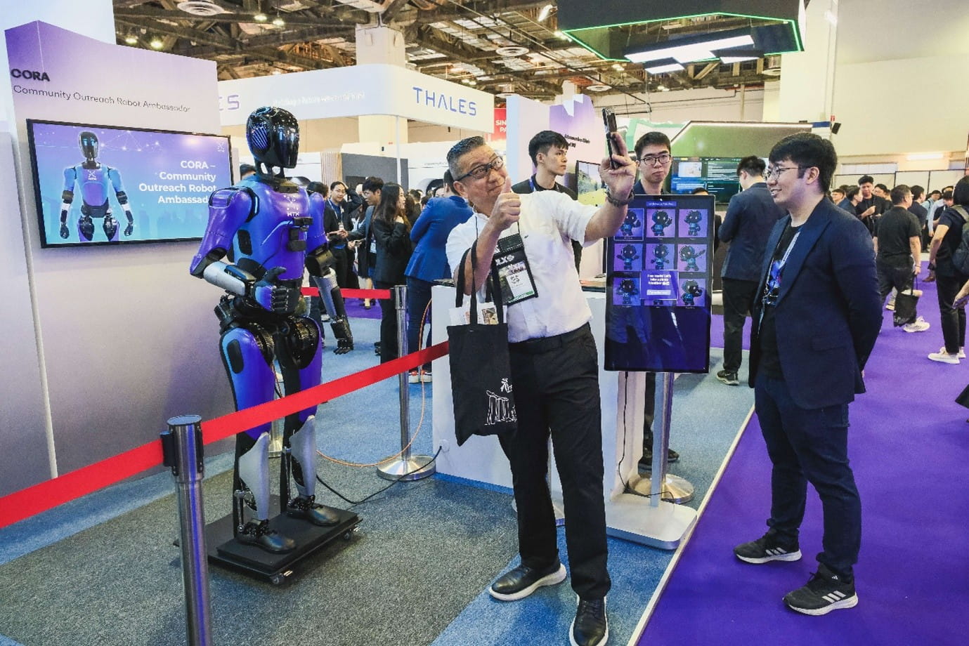 Tech exhibit booth featuring a humanoid robot.
